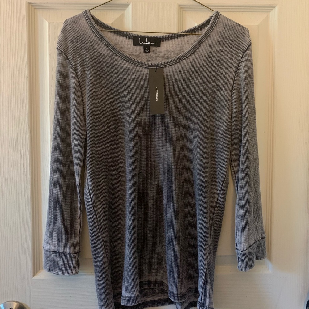 Brand new waffle knit three-quarter sleeve top.